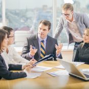 Death At Work Business people working together in meeting room